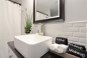 Combined shower/tub, hair dryer, towels, soap