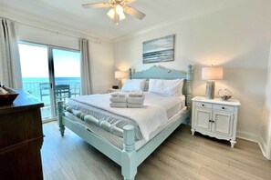 Relax in a classic room with a light blue bed frame, ocean views, and a spacious layout.