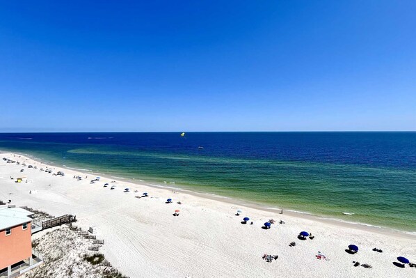 Relax on the beach with sun loungers and umbrellas, enjoy water activities and scenic views.