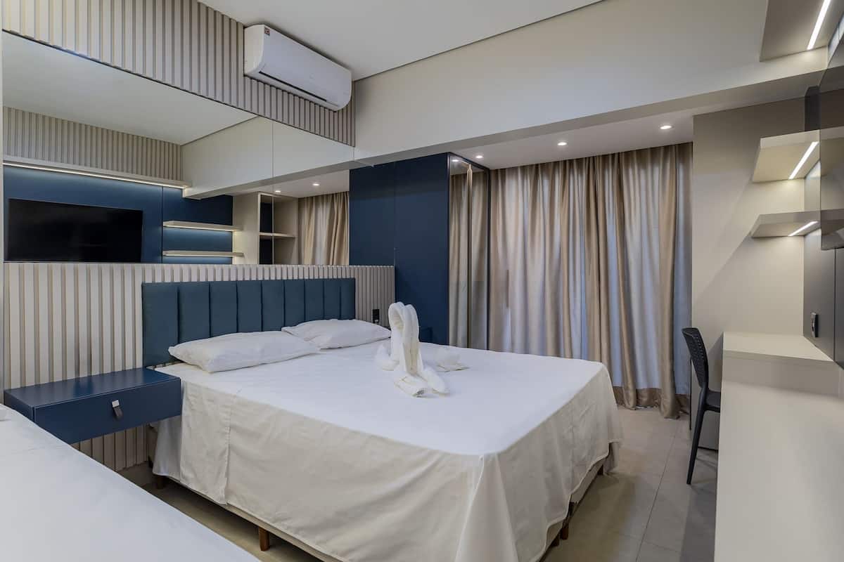 Deluxe Triple Room, Patio | Memory foam beds, minibar, blackout drapes, soundproofing