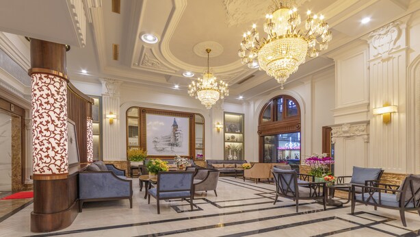A luxurious lobby with ornate chandeliers, plush seating, and a large framed artwork on the wall. - Marigold Hotel Dalat (Xuan Huong - Da Lat)