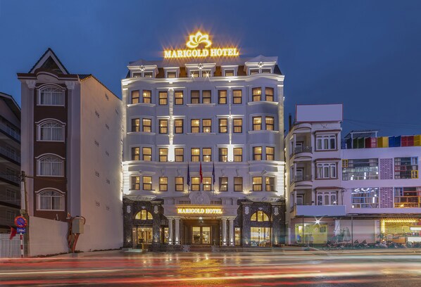 A large, multi-story hotel with a prominent marquee sign at the top.