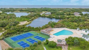 A tennis court complex with multiple courts, a pool, and surrounding greenery. - Soundside Home w/ Private Pool, Game Room, Basketball, and Nearby Beach Access (Avon)