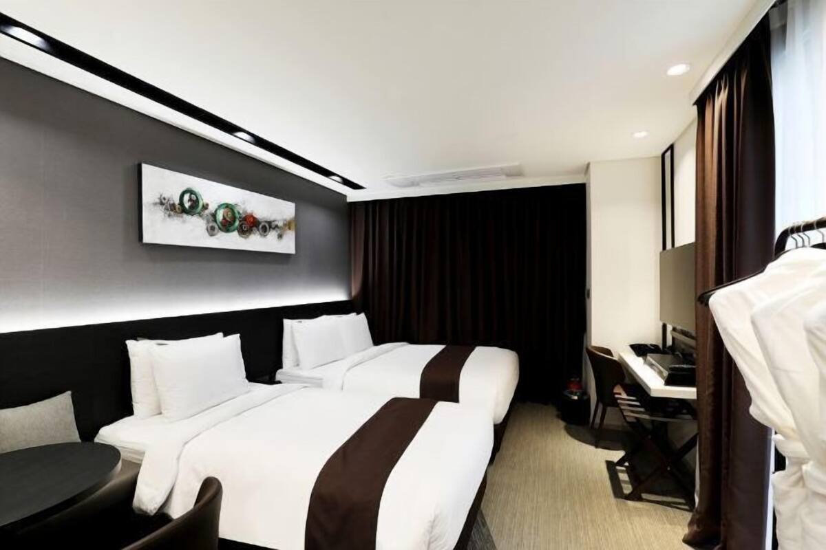 Premium bedding, desk, laptop workspace, iron/ironing board (on request)