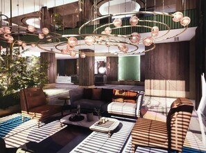 A modern lobby with a circular chandelier, seating areas, and a staircase leading to an upper level. - Park Dedeman Kastamonu (Kastamonu)