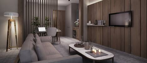 Un salon moderne avec un canapé, une table basse et un téléviseur fixé au mur.