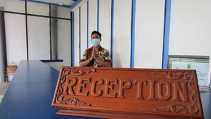 A reception desk with a sign that reads "RECEPTION".
