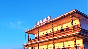 A multi-story building with the name "RAHAYU" prominently displayed on the facade. - Rahayu Jawarika Bromo Hotel (Ngadisari)