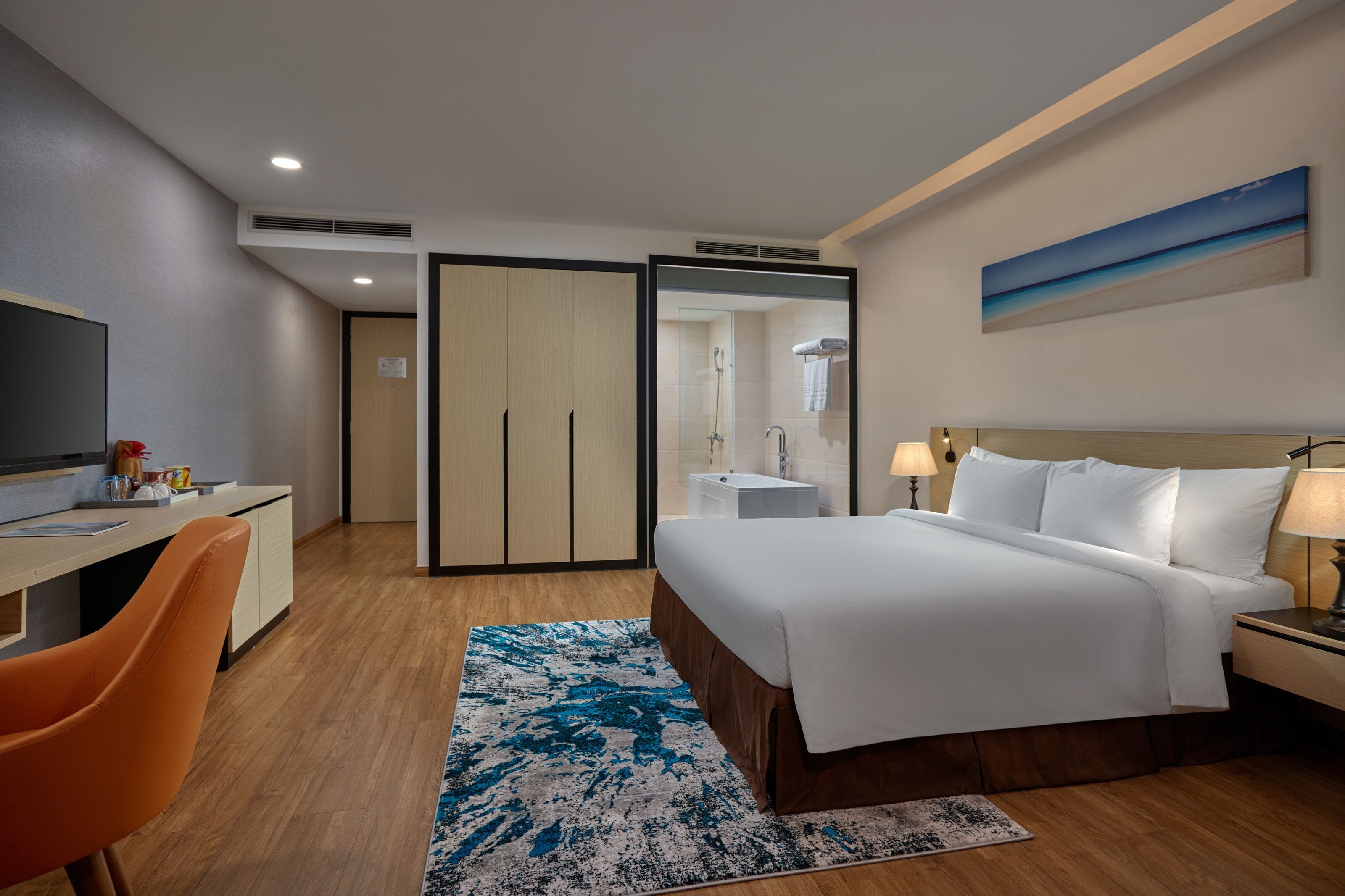Premium Deluxe Room | Minibar, in-room safe, desk, blackout curtains
