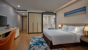 Premium Deluxe Room | Minibar, in-room safe, desk, blackout curtains