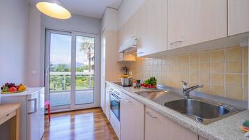 Family Apartment, Multiple Bedrooms, 2 Bathrooms (La Maison du Bonheur) | Private kitchen | Fridge, microwave, oven, stovetop