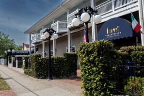 A building with a sign for 'Tarantelli's Ristorante Italiano' and another sign for 'The Tarrymore.'