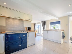 A modern kitchen with a built-in oven, white cabinets, and a large window. - 3 bedroom accommodation in Cambridge, near Lower Cam (Cambridge, near Lower Cam)