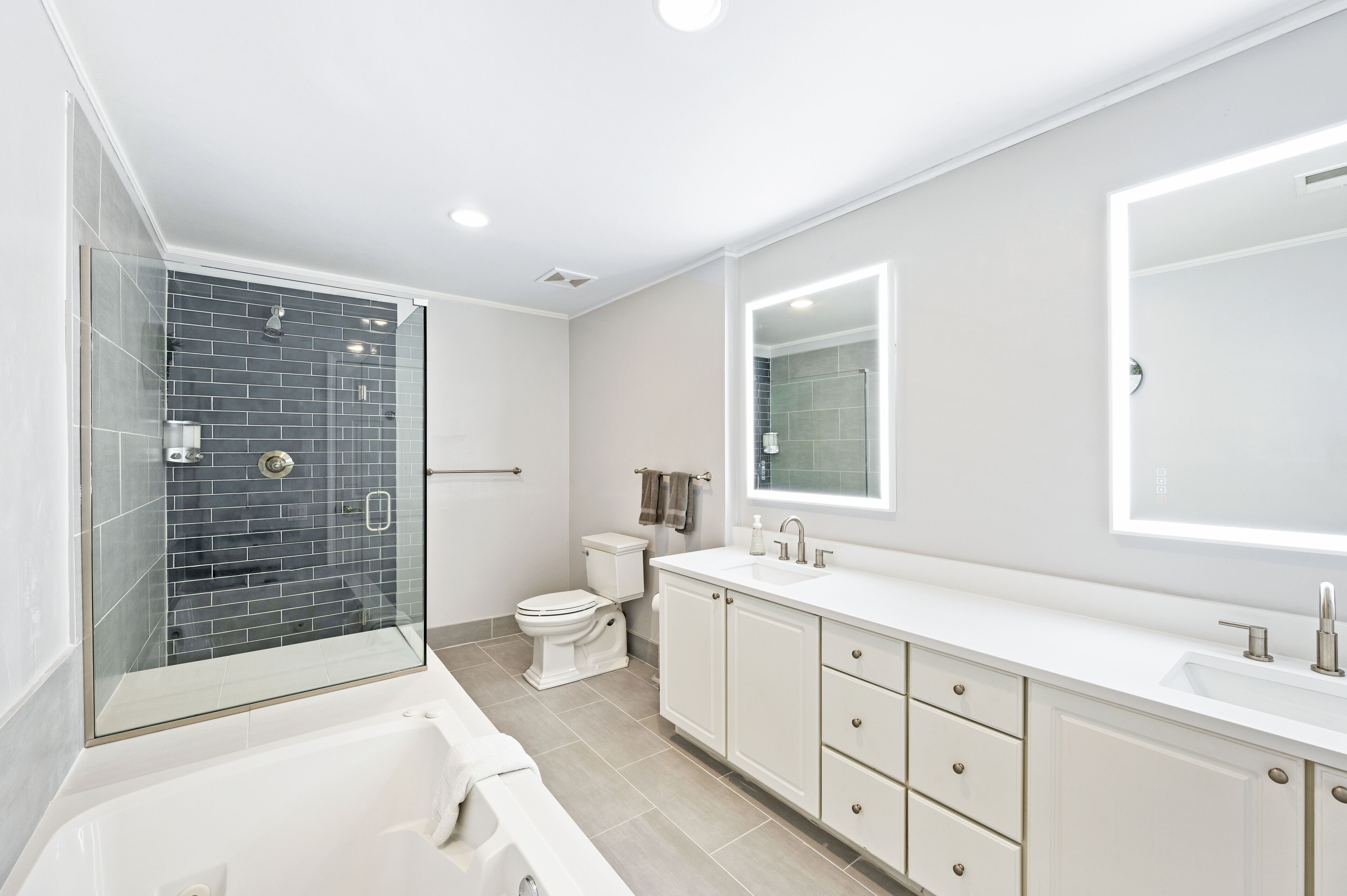 Bathtub, jetted bath, hair dryer, towels