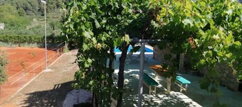 Tennis court and outdoor pool villa