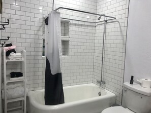 Combined shower/tub, hair dryer, towels, soap
