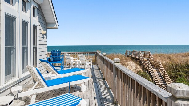 A wooden deck with lounge chairs and a view of the ocean. - Chez la Mer – Oceanfront 5BR Sanderling Home with Private Walkway & Big Views (Duck)