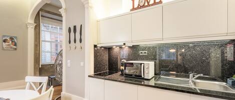 Fridge, microwave, stovetop, coffee/tea maker