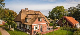 Beautiful nostalgic holiday farm with modern bathroom and characteristic living room.