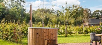 Beautiful nostalgic holiday farm with modern bathroom and characteristic living room.