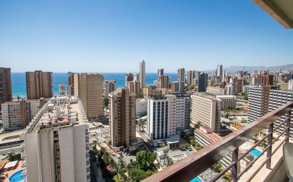 Stunning high-rise complex in a central urban location overlooking a body of water.
