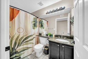 Bathtub, hair dryer, towels, soap