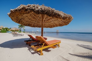 On the beach, sun loungers, beach towels