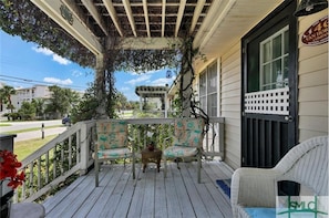 Sit on the porch and enjoy the view from this charming outdoor space.
