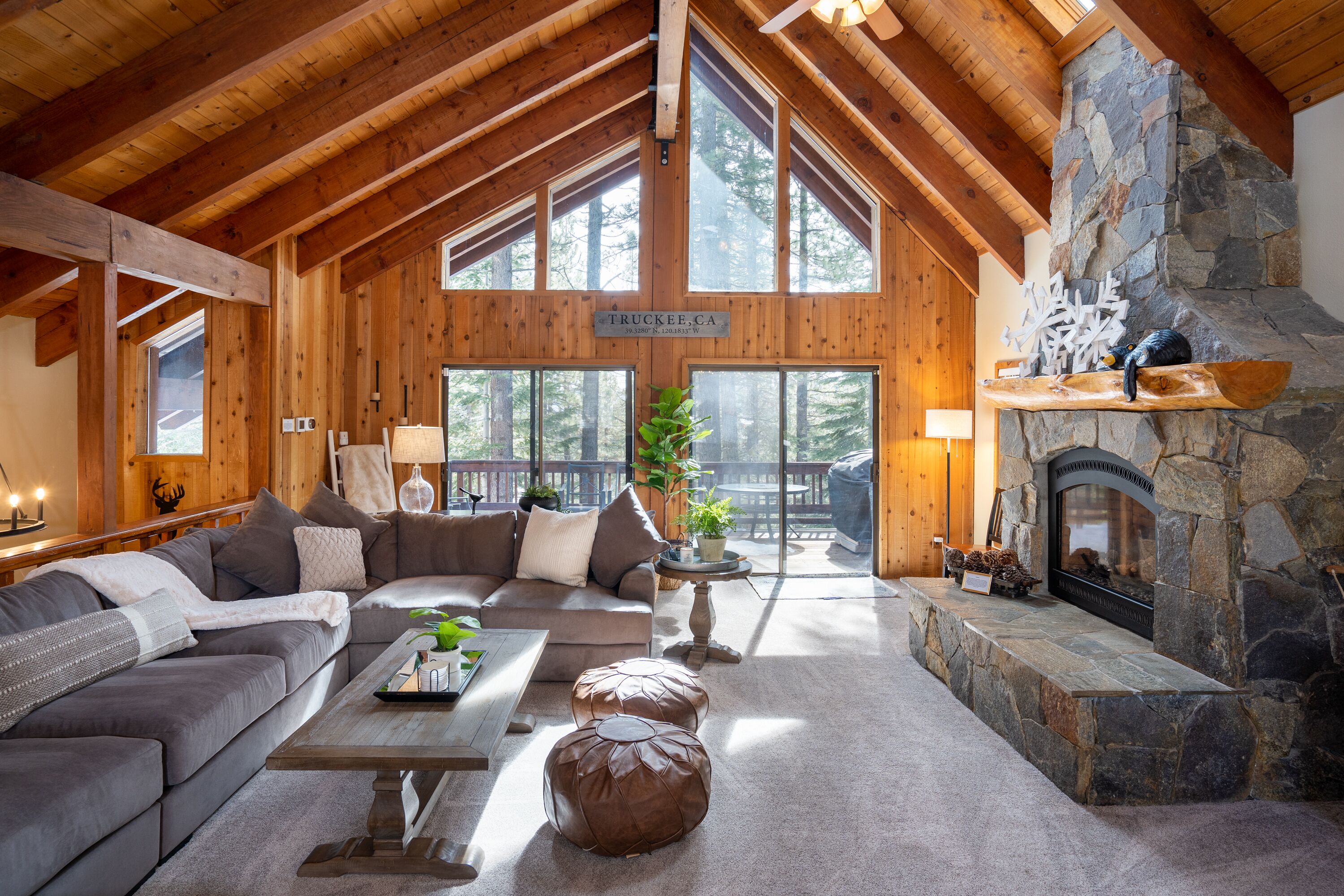 Family Room with new oversized couch and fireplace, 72 inch smart tv
