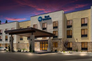 A Best Western hotel with a modern facade, stone accents, and a covered entrance. - Best Western Colfax (Colfax)