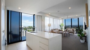2 Bedroom Panoramic High Floor | Living area | 100-cm Smart TV with digital channels, TV, DVD player - X Kirra Apartments (Coolangatta)
