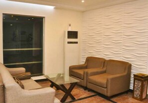 Room, 1 Bedroom, Smoking, Private Pool | Living room | TV, books - Room-de Brass Suites Hotel - Deluxe (Yenagoa)