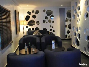 Room, 1 Bedroom, Smoking, Private Pool | Living room | TV, books - Room-de Brass Suites Hotel - Deluxe (Yenagoa)