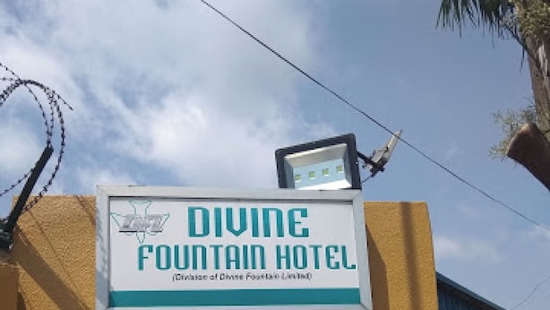 A sign for the Divine Fountain Hotel with a clear view of the building's exterior. - Room-divine Fountain Hotel - Guest Room (Lagos)