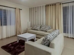 Room, 3 Bedrooms, Accessible, Smoking | Living area | TV