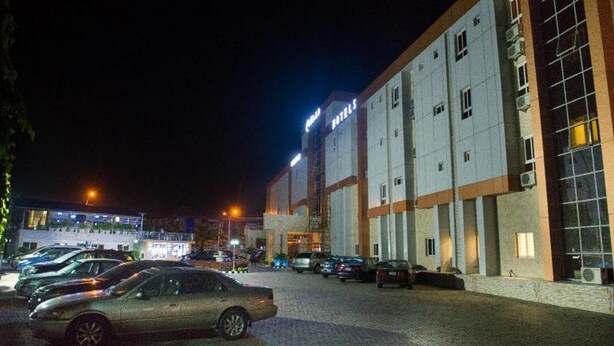 A hotel with a sign indicating it is a hotel. - Room-presken Hotels Abuja-guest Room (Abuja)