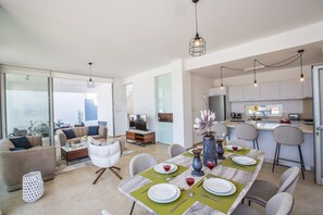 Enjoy a comfortable stay in this apartment with a spacious living area, dining space, and a balcony offering a city view.