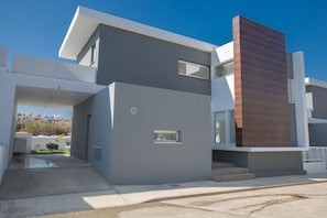 Stylish two-story building with a modern, minimalist design.