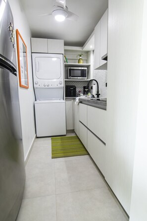 Fridge, microwave, stovetop, coffee/tea maker