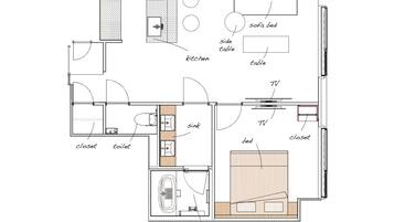 A floor plan of a hotel room with a kitchenette, a bathroom, a living area with a TV, a sofa bed, and a side table.