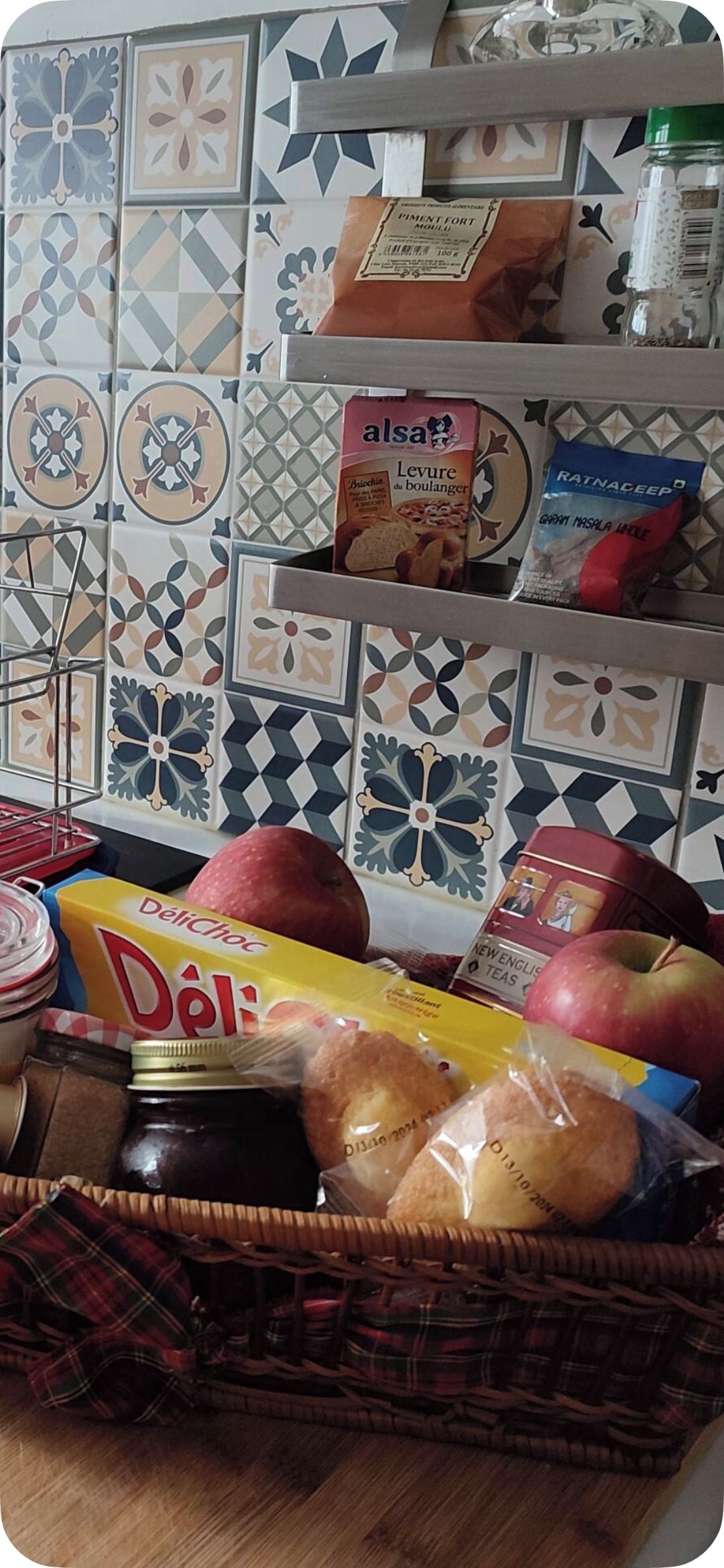 A kitchen counter with various food items and kitchenware.