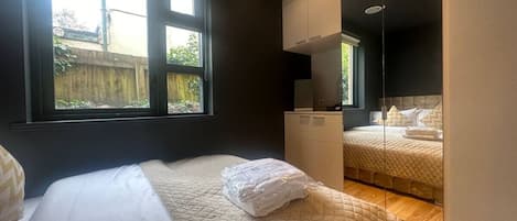 1 bedroom, desk, iron/ironing board, travel crib