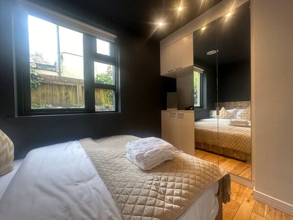 1 bedroom, desk, iron/ironing board, travel crib