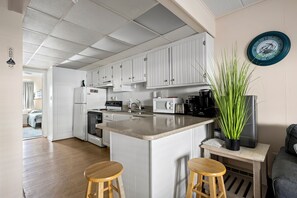 Microwave, dishwasher, dining tables