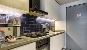 Fridge, microwave, oven, stovetop - Mag318 by Bespoke Holiday Homes - Luxurious Studio Apartments (Dubai)