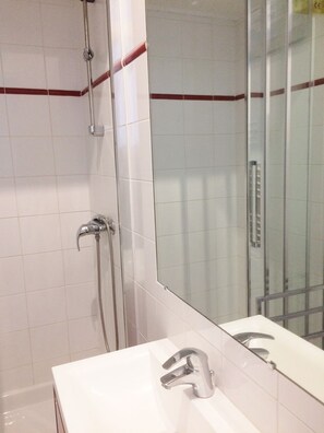 Shower, hair dryer, towels, toilet paper