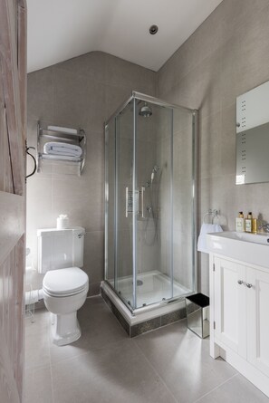 Combined shower/tub, hair dryer, towels, soap