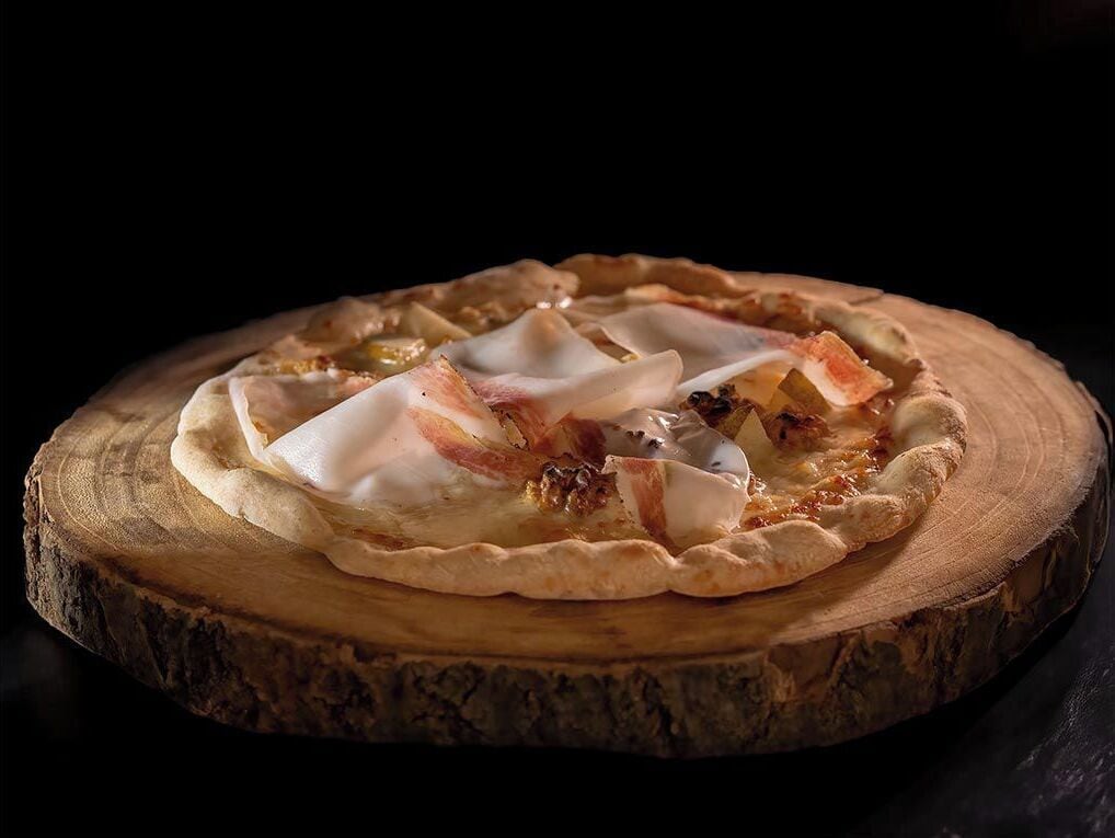 A pie on a wooden board.