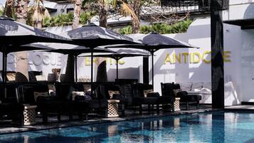 Seasonal outdoor pool, open 11:00 AM to 8:00 PM, pool umbrellas