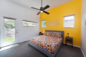 A bedroom with a bed, a ceiling fan, and two windows. - Townhome with Awesome Views - 1 Mile to Downtown - 30+ Day Stay Required (Durango)